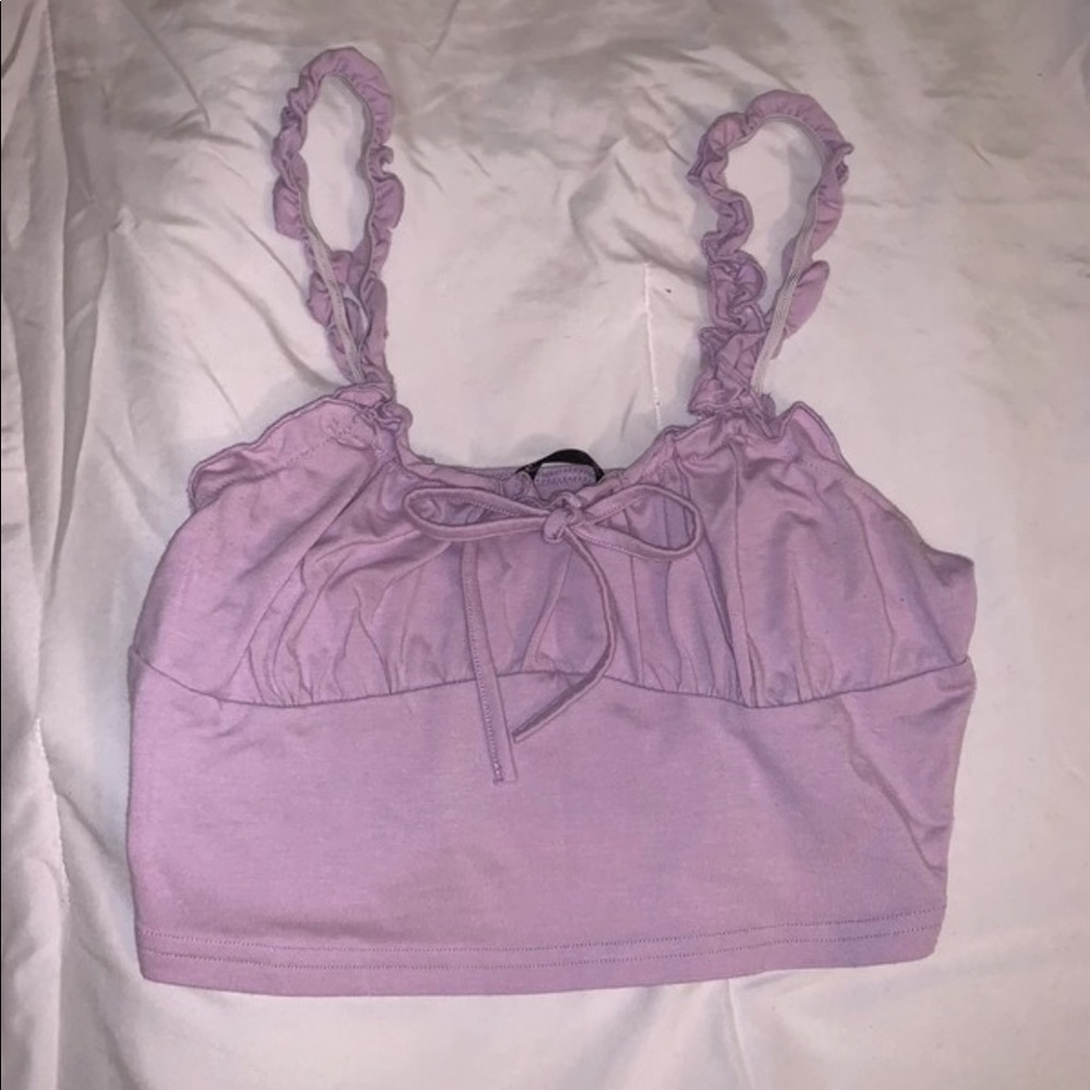 Has ruffled straps and a cute bow in the front